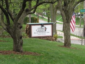 stone chalet sign on front lawn