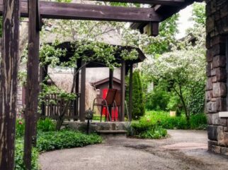 pergola patio is an outside space near the gazebo gardens and the formal dining room